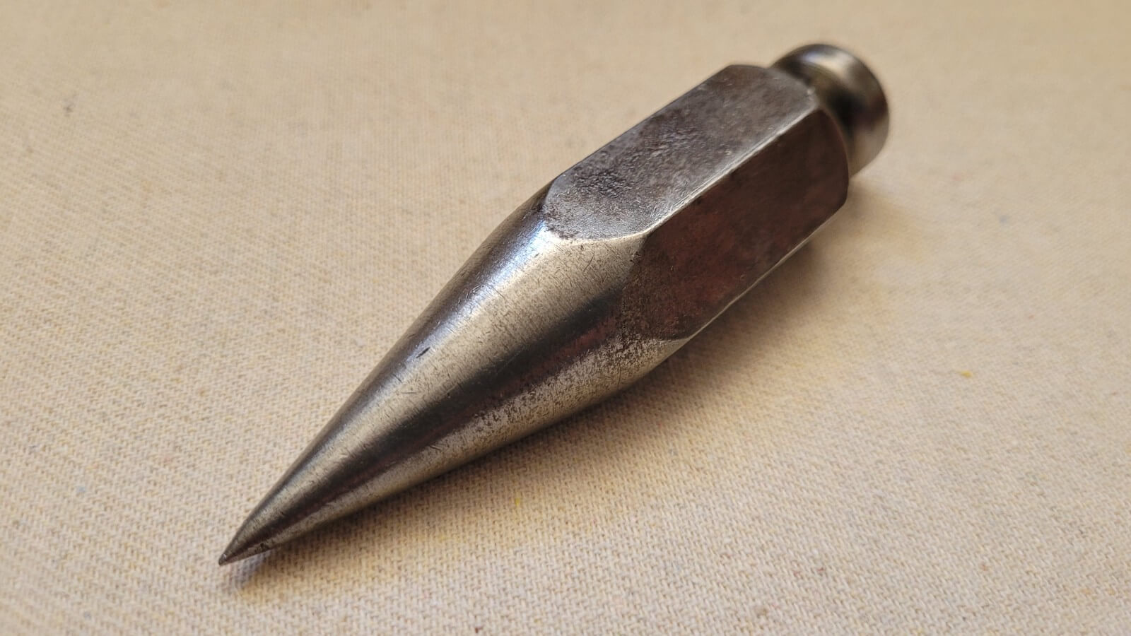 Solid steel 100z vintage hexagonal plumb bob, 4 inches long. This masons or surveyor measuring collectible tool