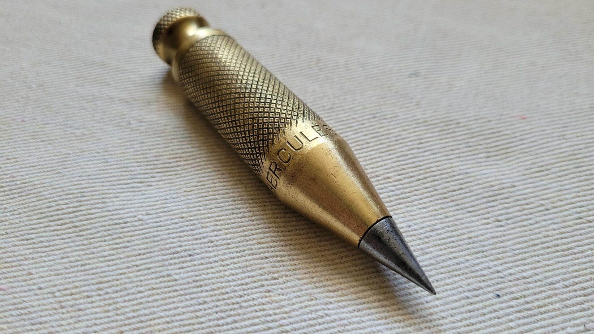 Vintage Solid Brass Hercules 8 Knurled Plumb Bob w Steel Point Tip - Vintage woodworking and stone mason marking and measuring collectible tools