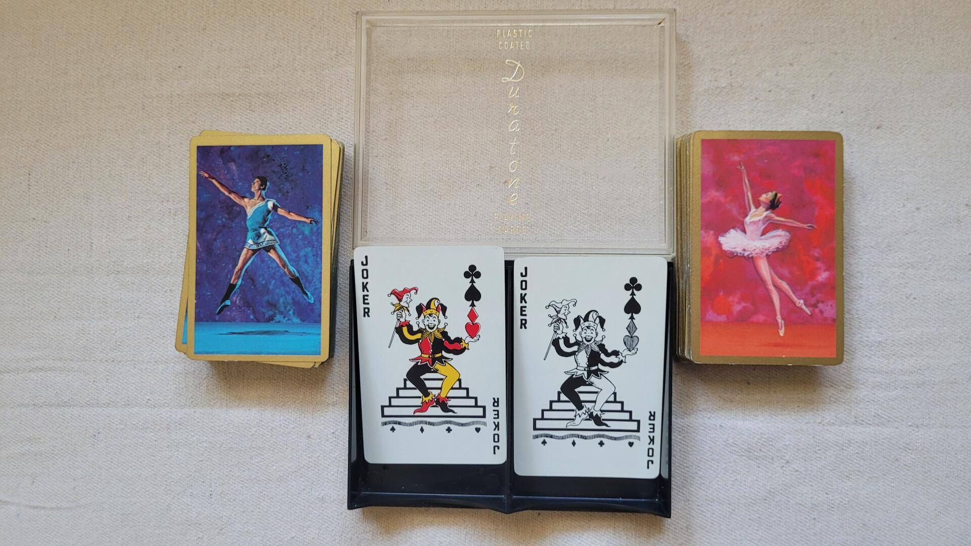 Vintage double deck of ARRCO Duratone playing cards in hard case with colourful ballerina & standing jokers design - made in USA collectible games and cards