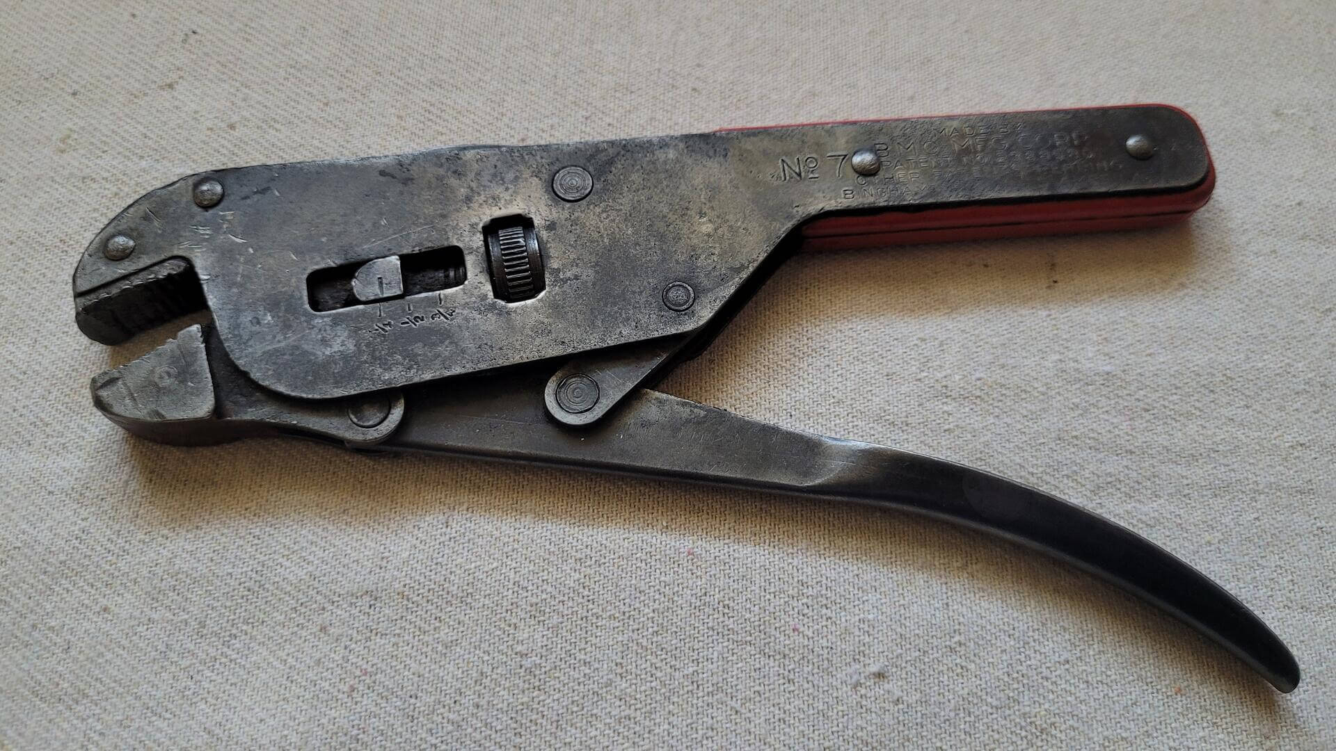 Rare antique No. 7 locking jaw adjustable wrench pliers Patent No 2388580 by Botnick Motor Corporation from Binghamton, NY. Vintage made in USA collectible hand tool marketed as "It's a wrench and 5 other tools"