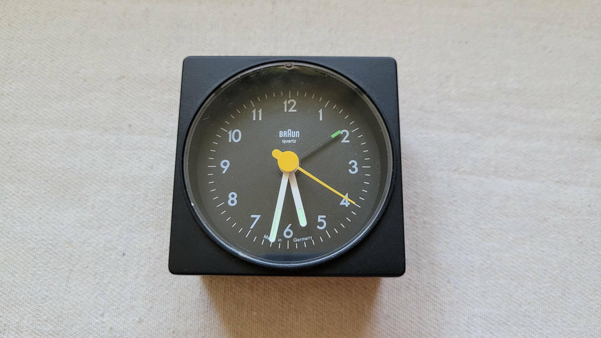 Rare retro 1987 Braun AG 4746 AB1 travel alarm analog clock designed by Dietrich Lubs under the supervision of Dieter Rams who was the head of design at Braun from 1961–1995. This vintage made in Germany collectible mid century table clock