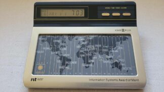 Rare vintage Howard Miller world time touchpad map quartz alarm clock. Retro collectible electronic gadget with the unique feature to set time zones using world map touchpad and a beautiful example of functional and clear user interface design.