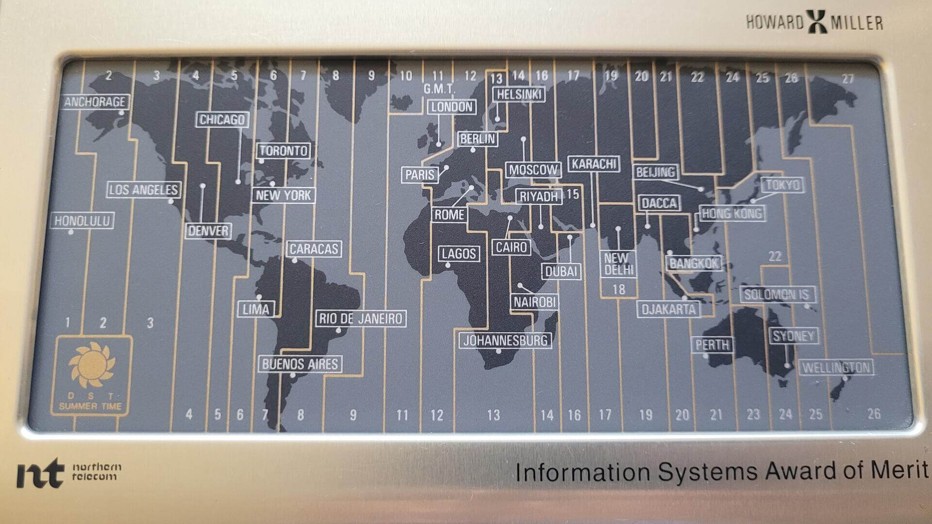 Rare vintage Howard Miller world time touchpad map quartz alarm clock. Retro collectible electronic gadget with the unique feature to set time zones using world map touchpad and a beautiful example of functional and clear user interface design.