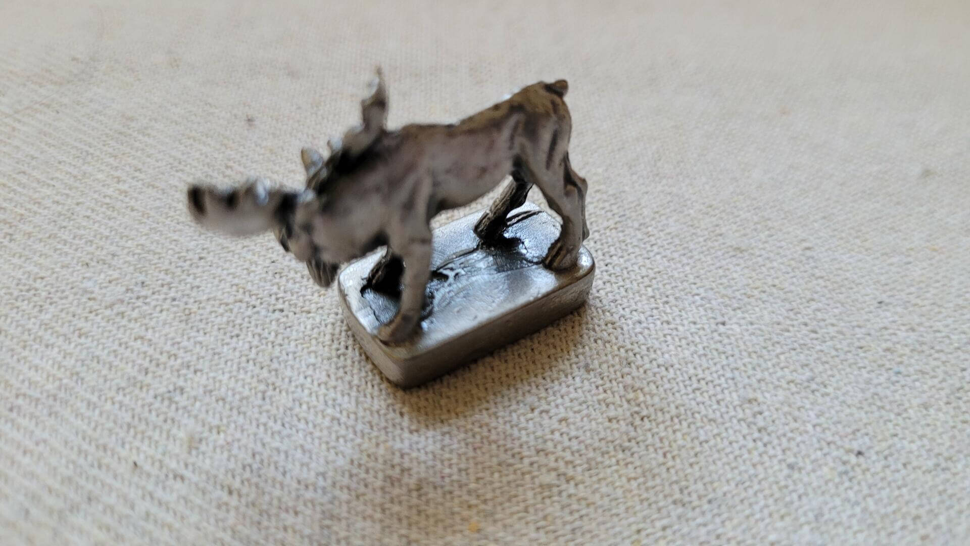 Miniature vintage pewter casting moose figurine sculpture one inch small with Canada engraving on the base