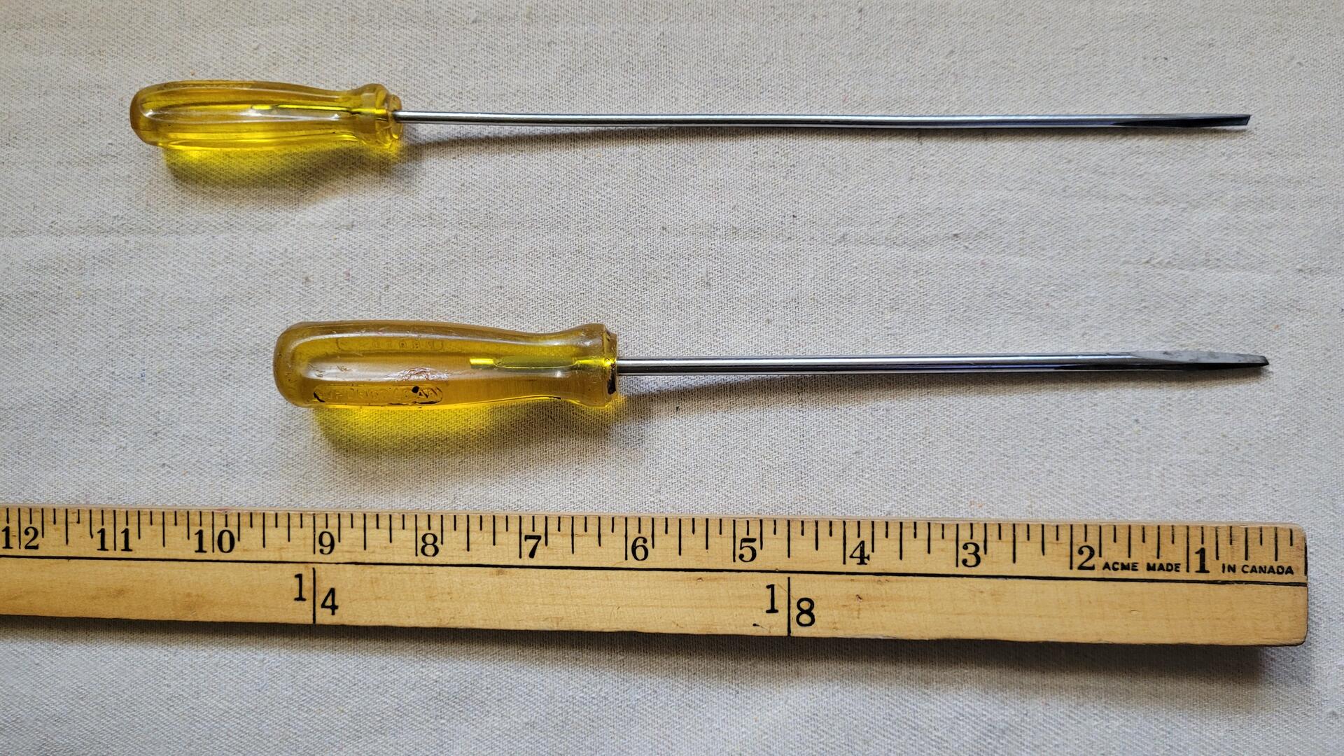Rare MFD9634CAN and MFD9627CAN pair of vintage long classic Proto flat head screwdrivers with yellow unbreakable handles. Antique mid century made in Canada collectible hand tools