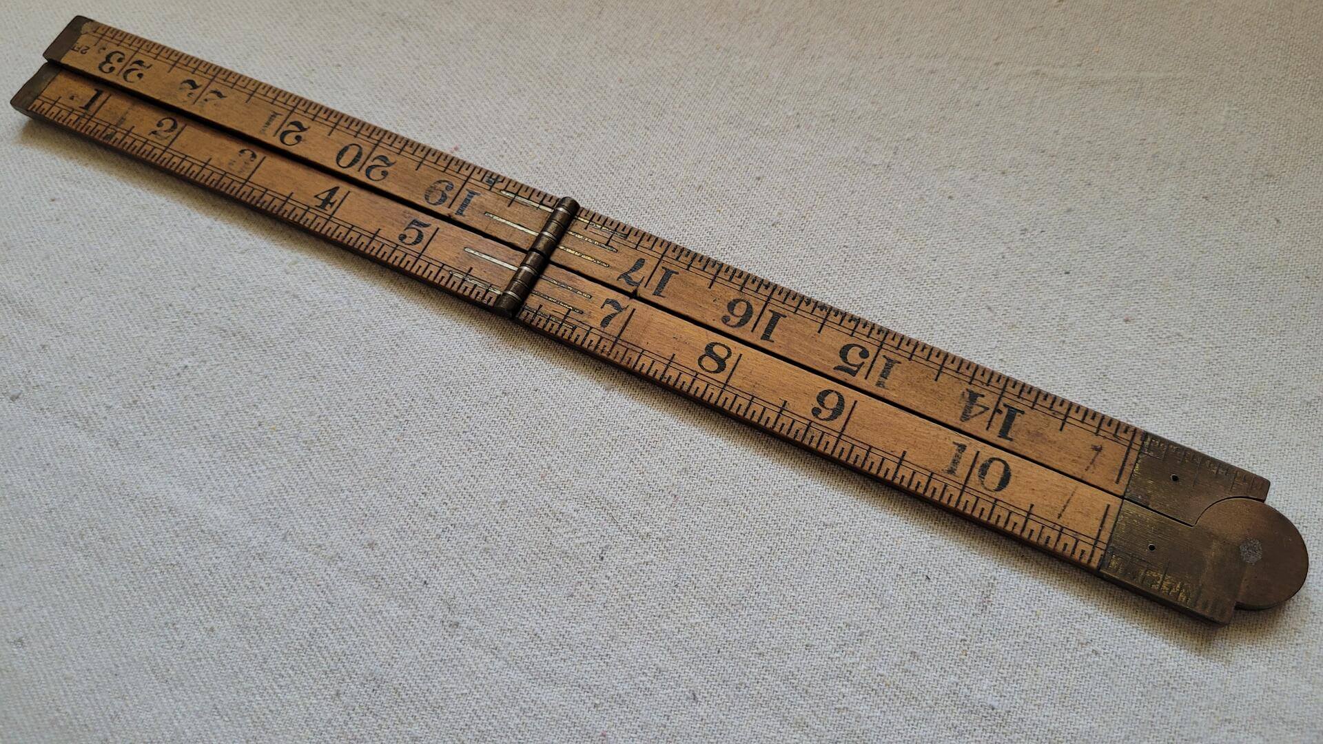 Vintage Rabone No. 6080 warranted boxwood and brass folding ruler two feet long. Rare antique made in England collectible yardstick and measuring tool