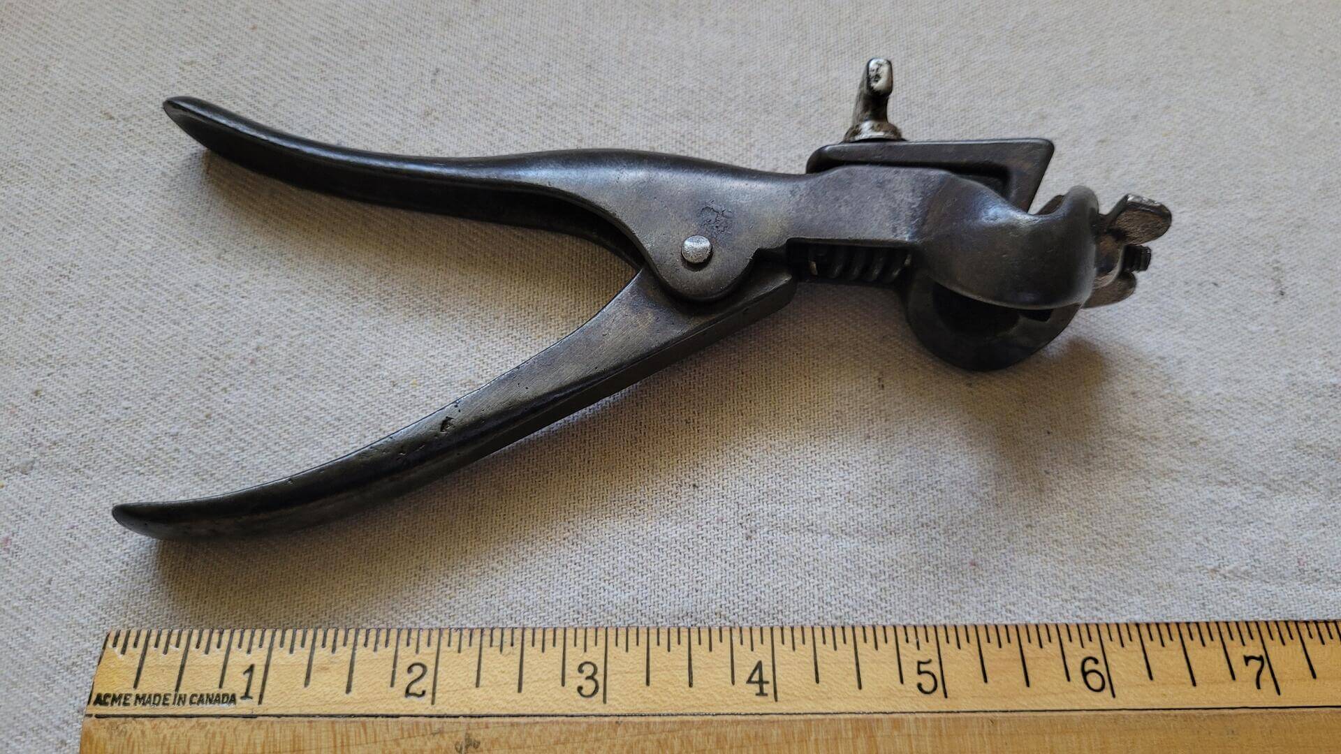 Nice vintage woodworking and carpentry cast iron adjustable hand saw set pliers used to set distance the saw tooth is bent away from the saw blade. The magnitude of set determines the cut width and prevents the blade of the saw from binding in the wood.
