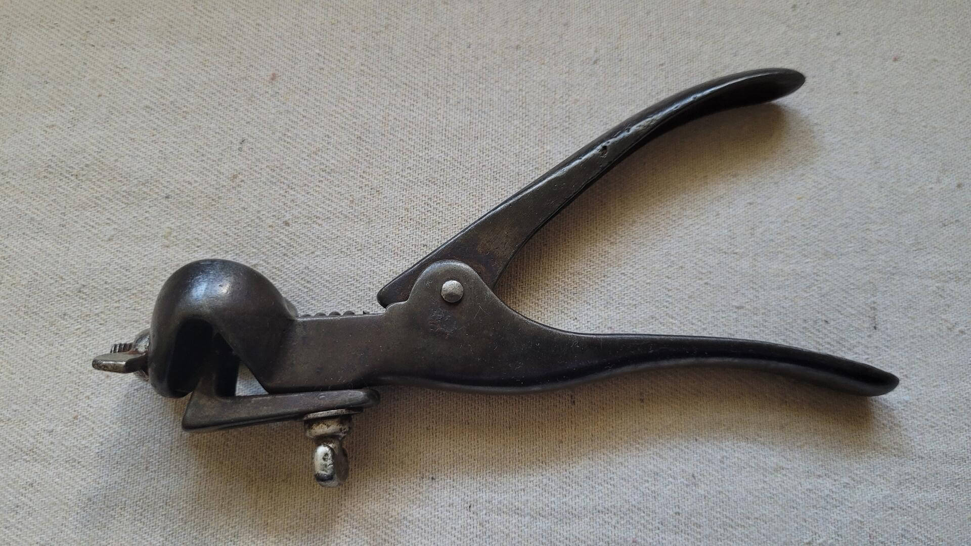 Nice vintage woodworking and carpentry cast iron adjustable hand saw set pliers used to set distance the saw tooth is bent away from the saw blade. The magnitude of set determines the cut width and prevents the blade of the saw from binding in the wood.
