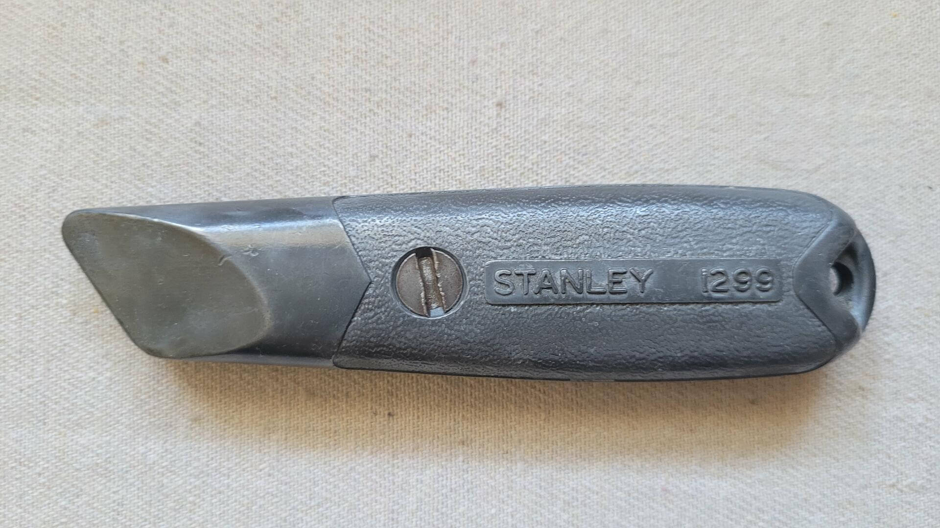 Vintage Stanley 1299 fixed blade cast steel utility knife box cutter. Antique made in USA collectible classic mid century design cutting hand tools