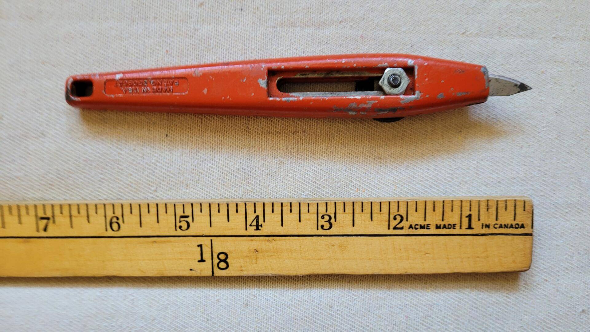 Retro 1970s Stanley Tools orange cast steel "Slimknife" No. 28-108 retractable blade utility knife cutter - Antique and vintage made in USA collectible cutting tool