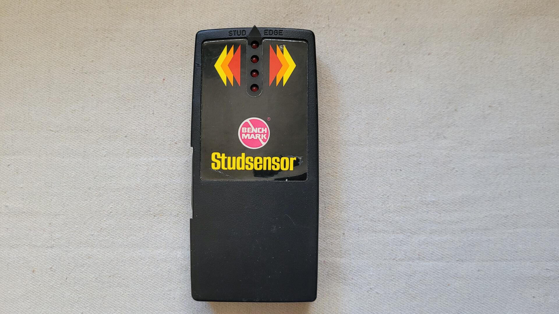 Rare vintage Benchmark Studsensor battery powered hendheld wall stud finder with red LED indicator lights in working condition - 1980s Retro collectible measuring and marking tools
