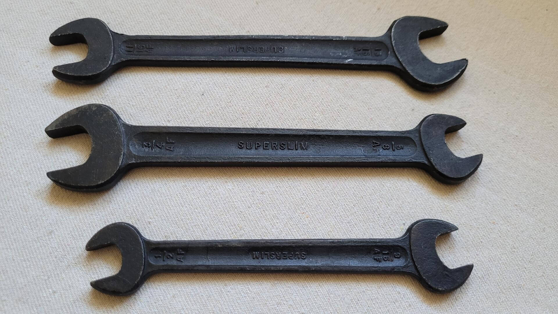 Beautiful vintage set of three T. Williams Drop Forge & Tools Ltd black-phosphate coating open end spanner wrenches. Antique made in England collectible mechanic hand tools 13/16 11/16 3/4 5/8 9/16 and 1/2 sizes