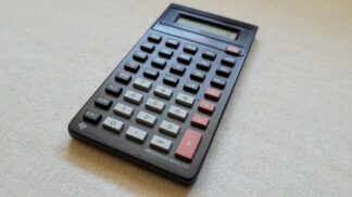 Vintage Texas Instruments BA-35 business analyst calculator. Retro 1980s made in Italy collectible electronics and business tools and gadgets