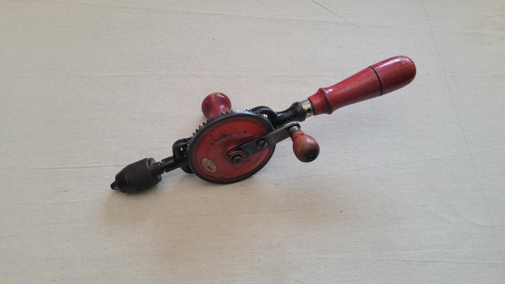 Vintage woodworking Hoppe egg beater style hand drill with red wooden handle. Rare antique made in Germany collectible carpentry hand tool