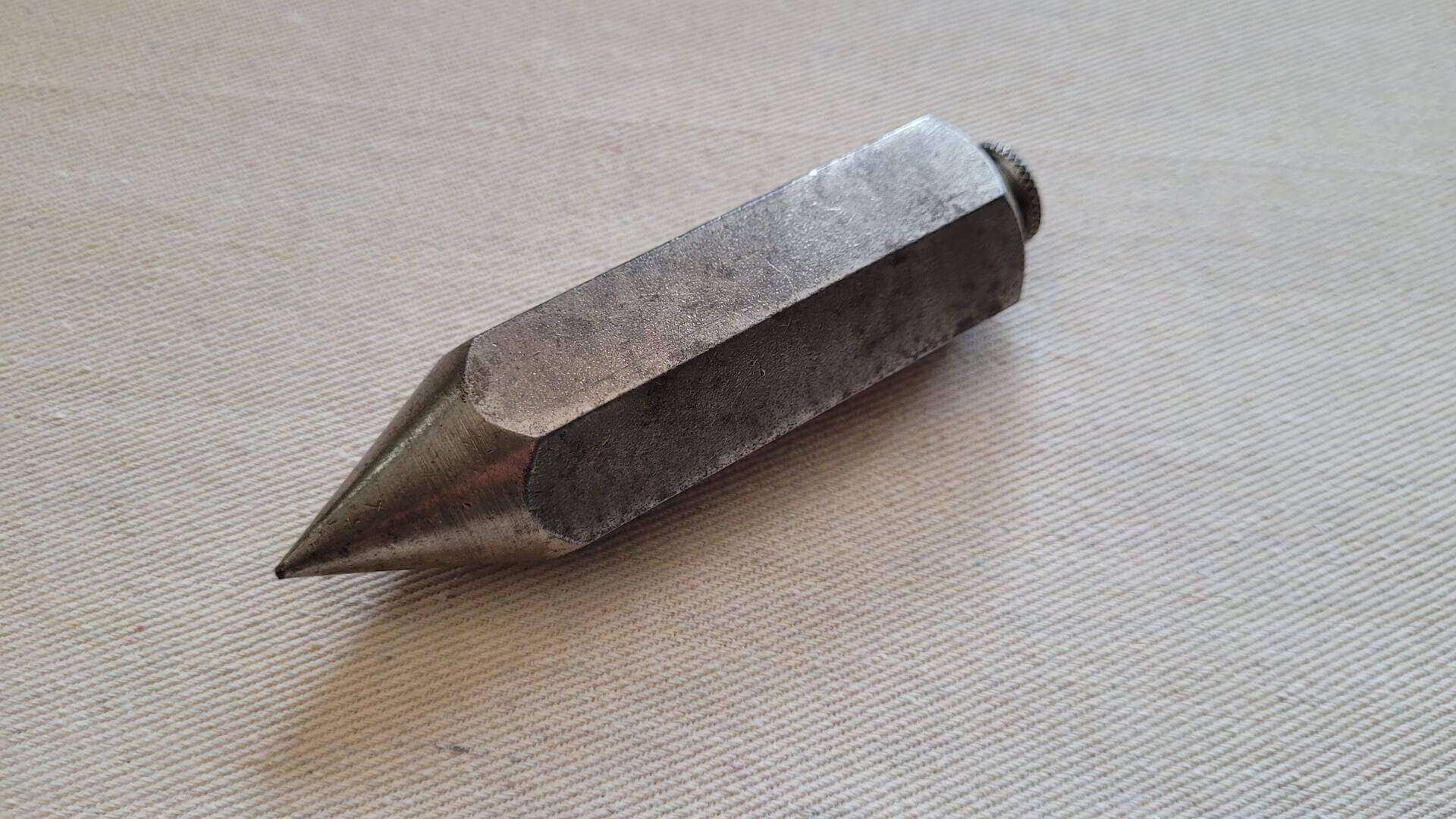 vintage hexagonal all steel pencil style surveying plumb bob 1 lb / 454g and 4 1/2" in length. Antique collectible marking and measuring tools