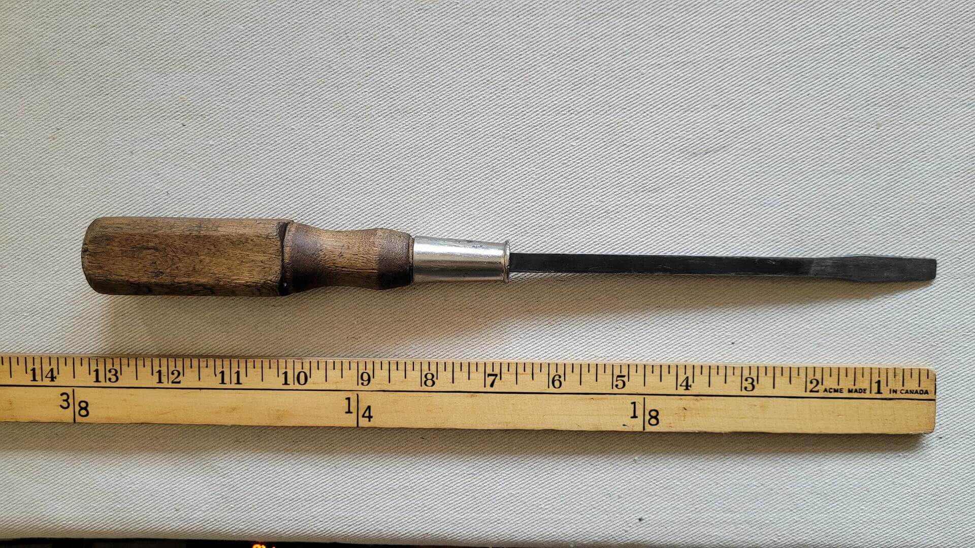 Large antique square shank flathead screwdriver with wooden handle 13 inches long. Vintage collectible cabinet maker and craftsman quality hand tools