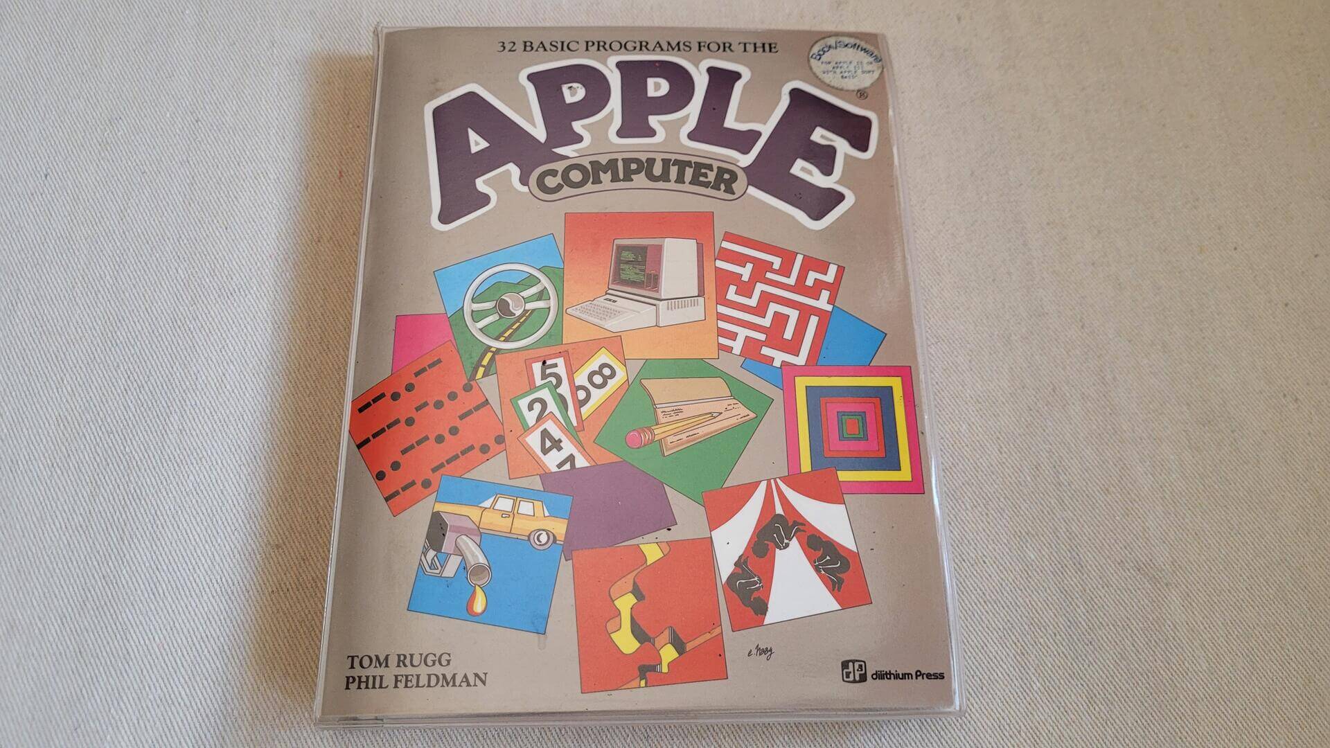 32 Basic programs for the Apple Computer, 1982 book by Tom Rugg and Phil Feldman and published by Dilithium Press. Rare vintage computer book with the sealed 5 1/4" disk that runs on Apple II, Apple IIe and Apple III computers and Applesoft Basic DOS 3.3 operating system