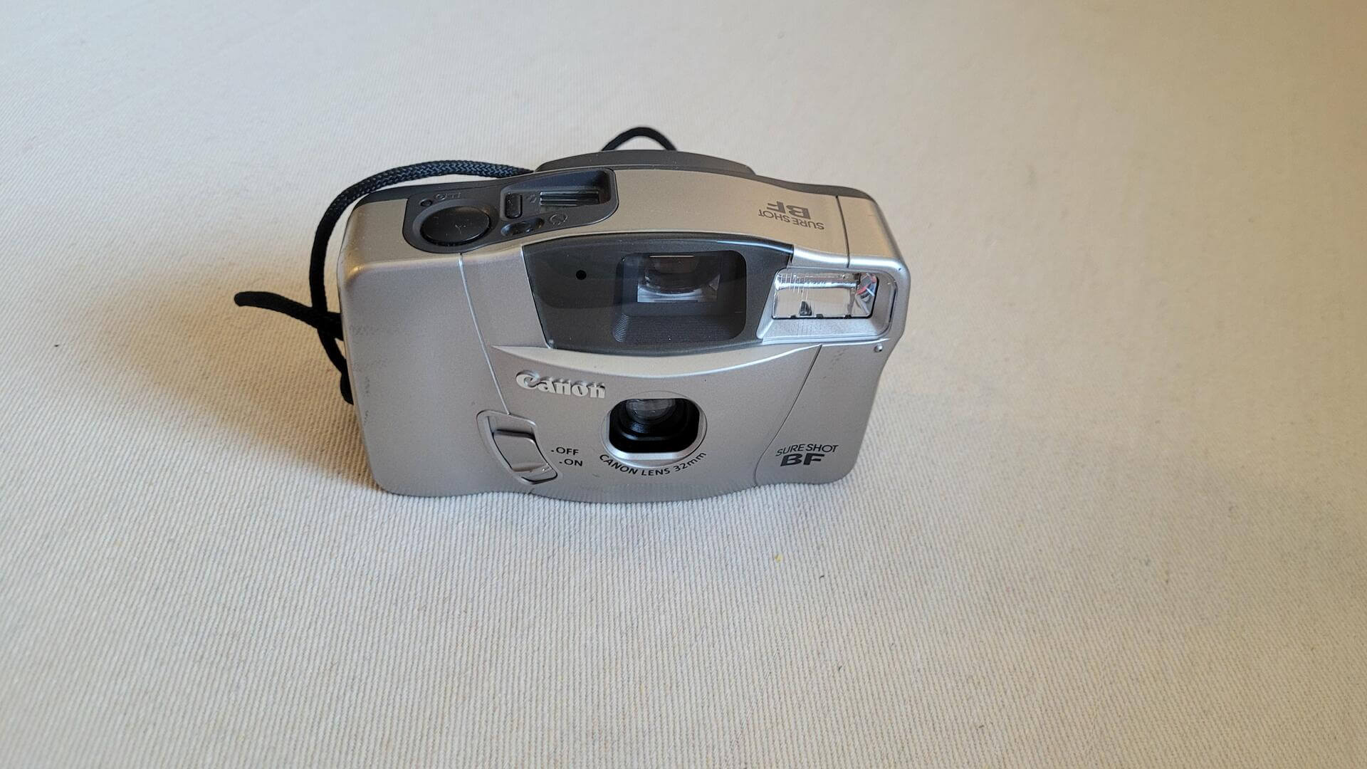 The Canon Sure Shot BF (aka Prima BF-9S) is fully automatic 35mm point-and-shoot vintage camera from 2000 with bright and large viewfinder. One of best selling cameras due to its simple and easy to use design.