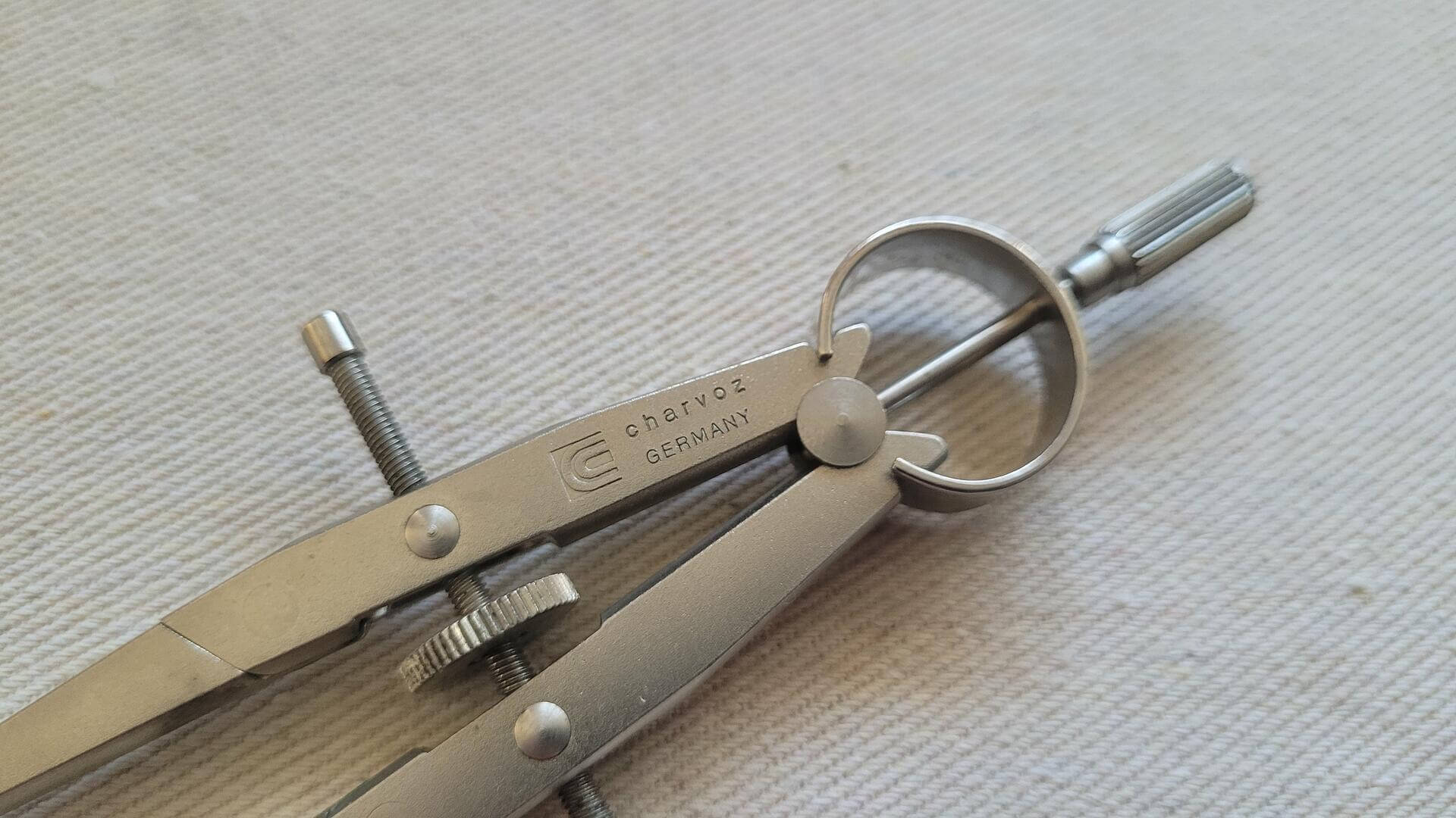Charvoz No 11-3331 adjustable spring compass with the case and two extra pieces. Vintage made in Germany quality collectible drawing instrument and drafting tool