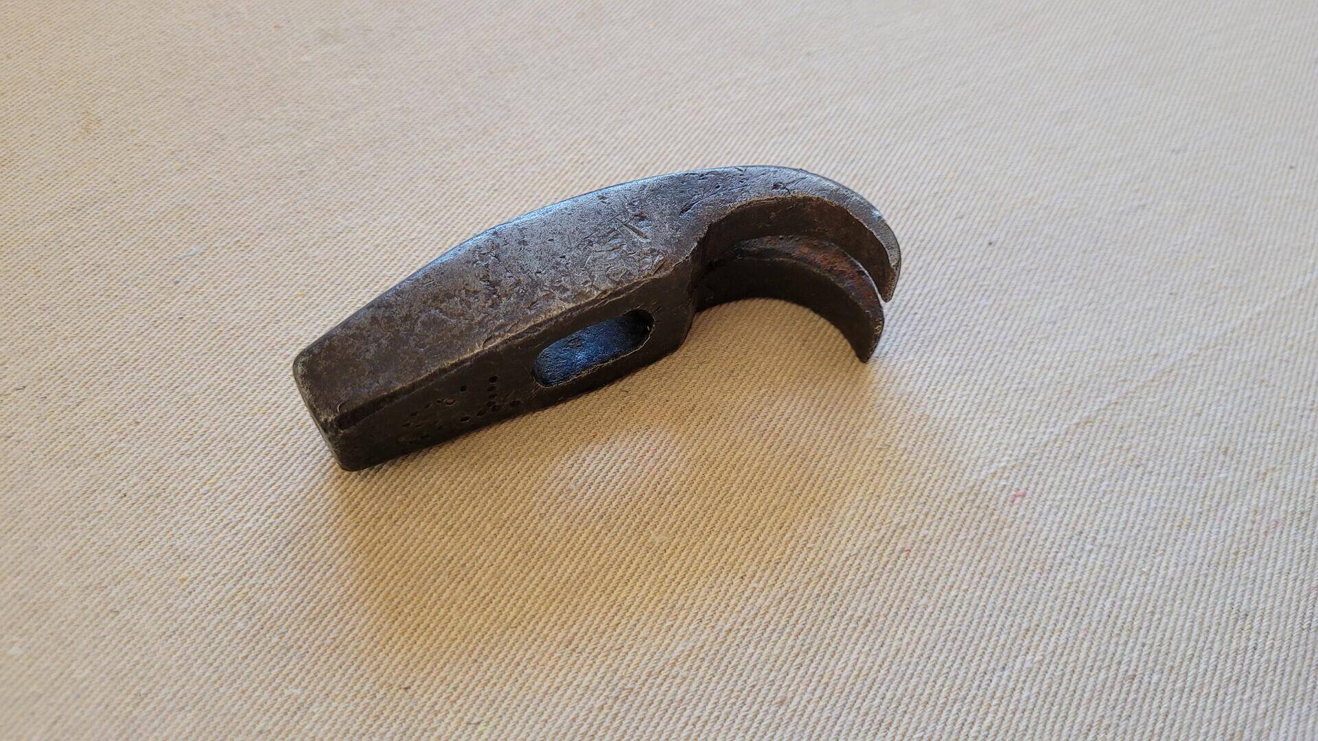 Vintage curved tapered claw farrier and cobbler tack hammer head 4 inches long. Antique collectible primitive leatherworking and upholstery striking hand tool