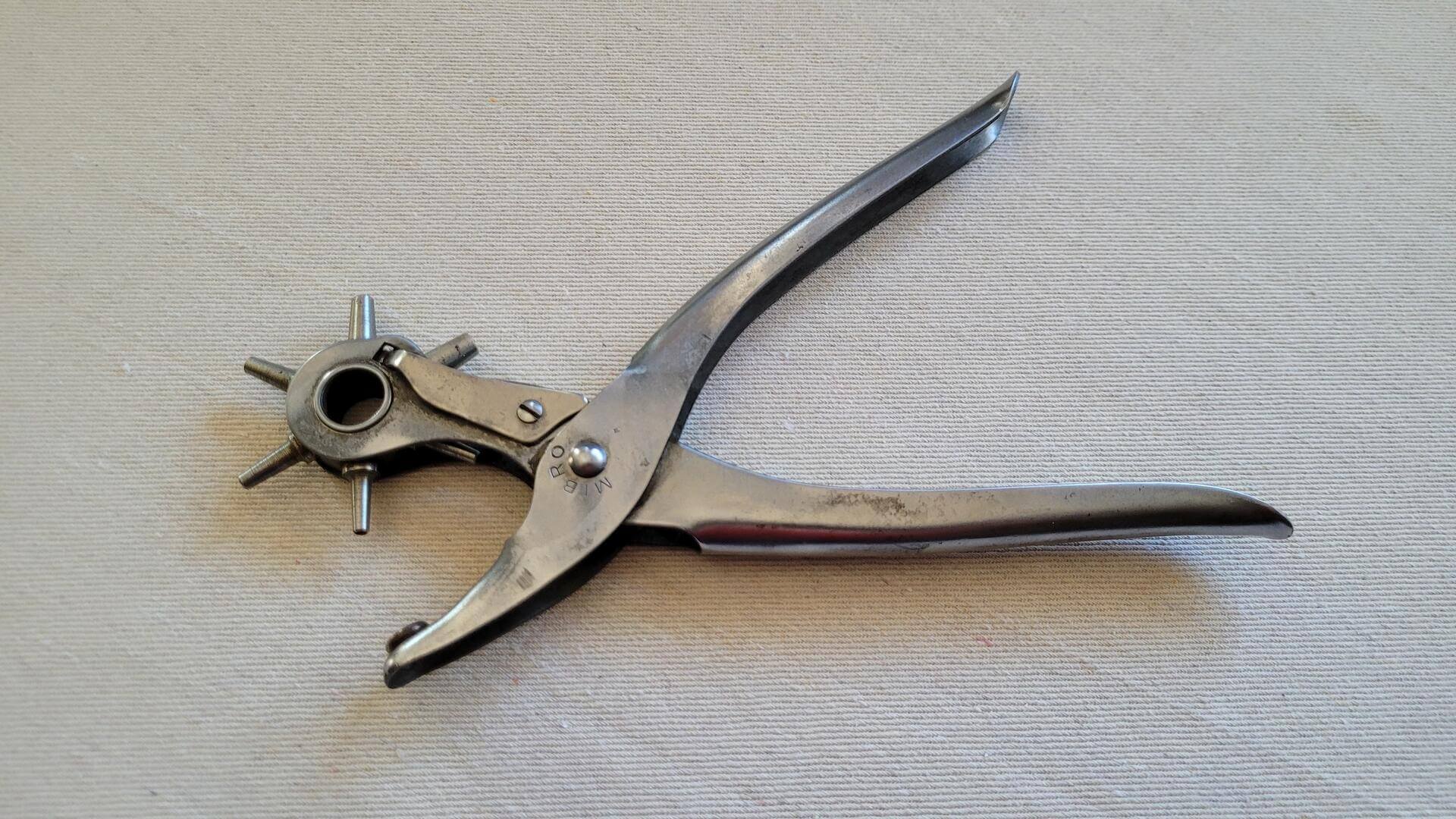 Vintage Mibro revolving leather hole punch pliers. Antique made in England collectible cobbler and leathermaking hand tool with 6 different punch size diameters