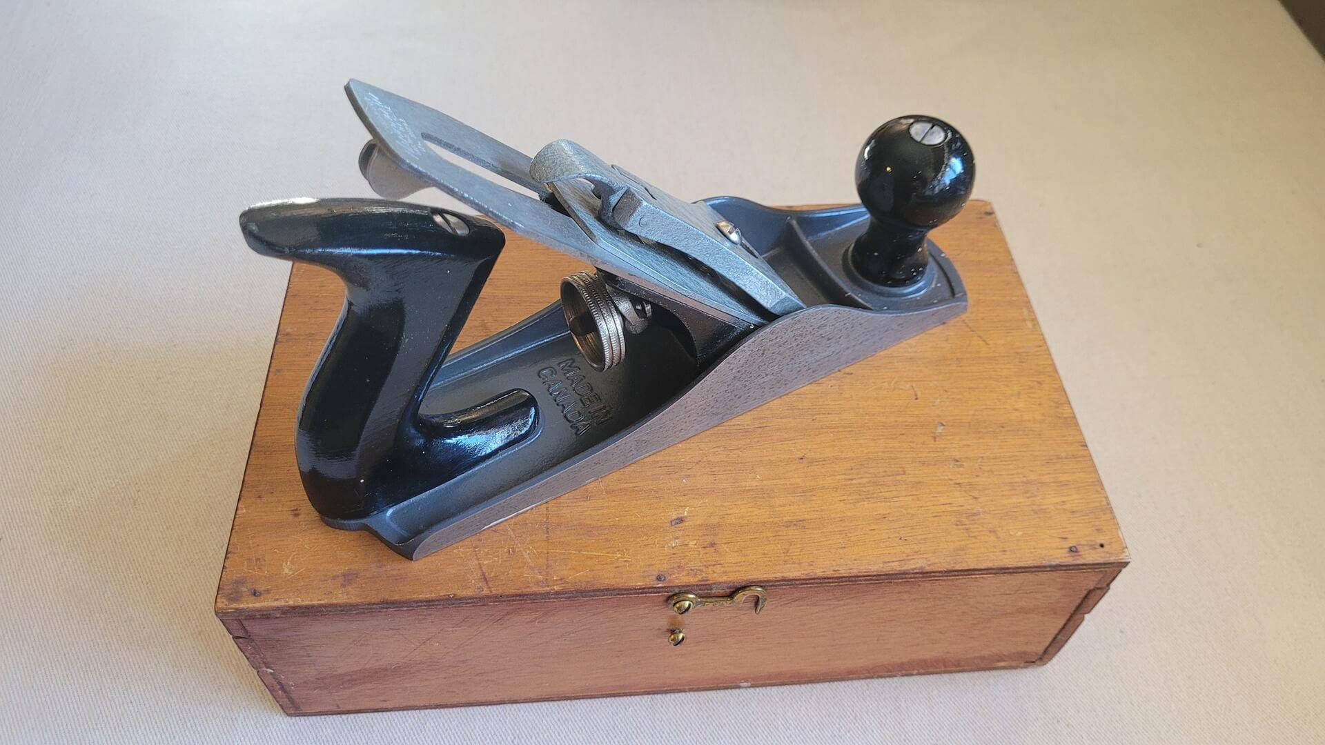 Vintage Stanley Handyman No. H1204 smooth bottom plane with the original wood latch case. Antique made in Canada collectible carpentry and woodworking plane and edge hand tools