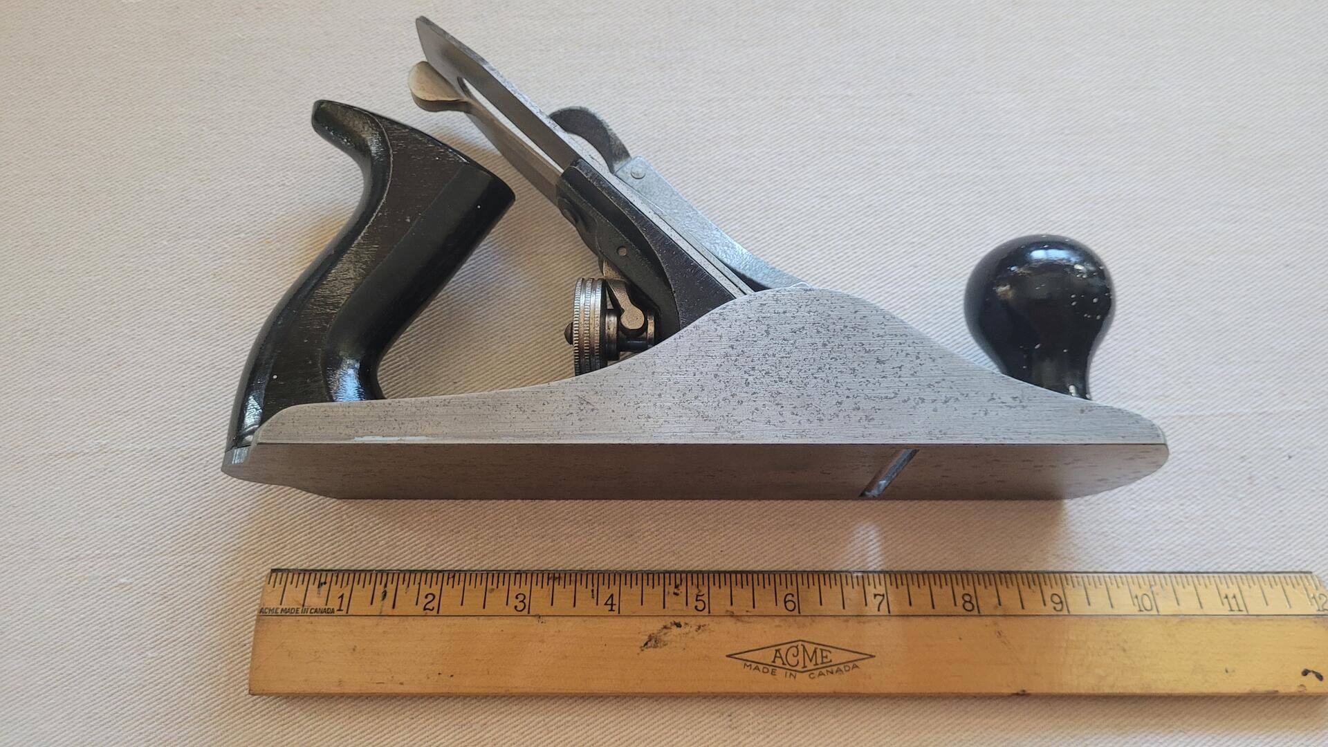 Vintage Stanley Handyman No. H1204 smooth bottom plane with the original wood latch case. Antique made in Canada collectible carpentry and woodworking plane and edge hand tools