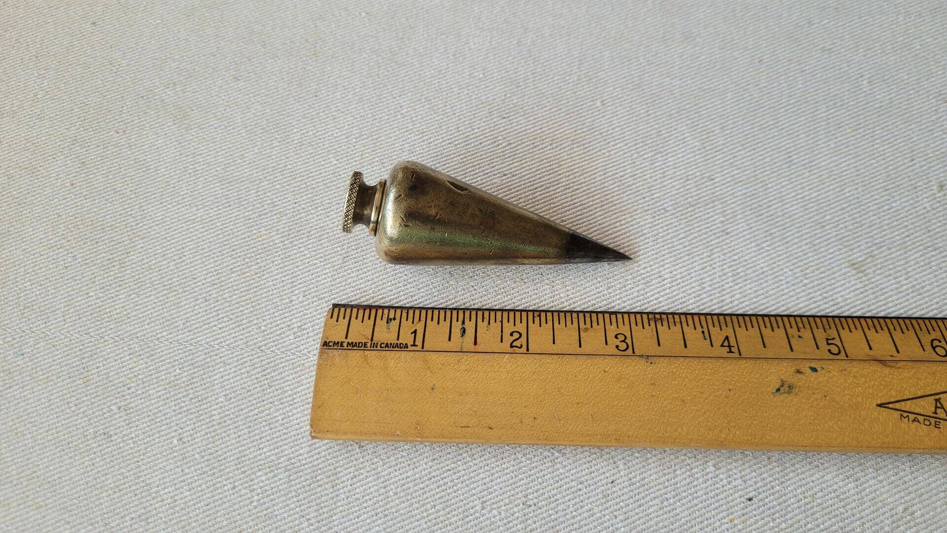 Beautiful antique turnip shaped solid brass plumb bob with the steel tip 5oz / 146g. Vintage marking and measuring collectible tools