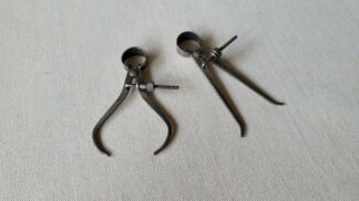 Vintage inside and outside spring divider calipers set. Antique collectible marking and measuring woodworking and machinist hand tools