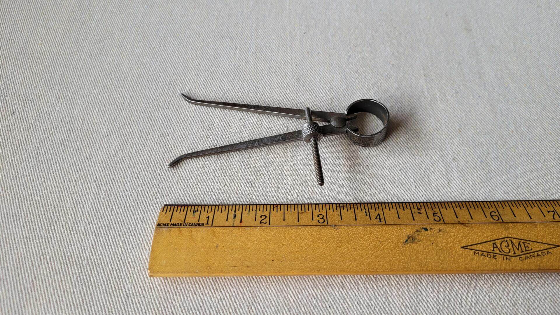 Vintage inside and outside spring divider calipers set. Antique collectible marking and measuring woodworking and machinist hand tools