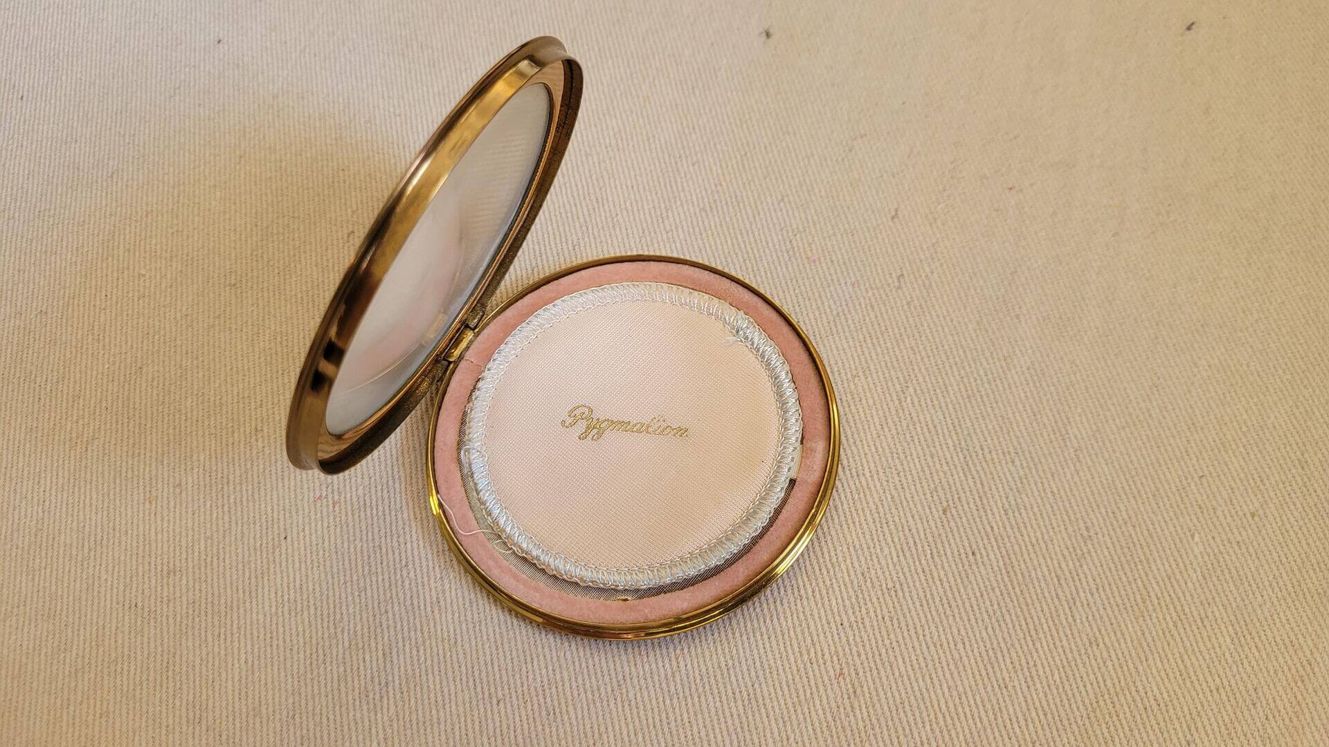 Vintage brass Pygmalion powder compact with the image of Queen Elizabeth II wearing the crown. Rare made in England compact and mid century MCM vanity cosmetics collectible