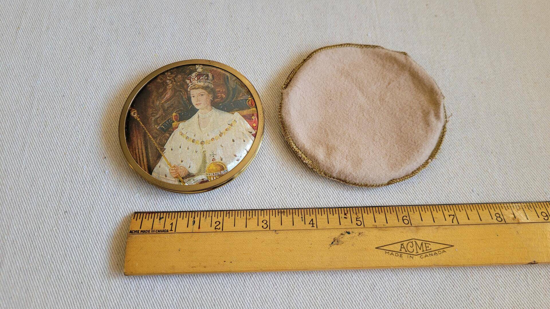 Vintage brass Pygmalion powder compact with the image of Queen Elizabeth II wearing the crown. Rare made in England compact and mid century MCM vanity cosmetics collectible