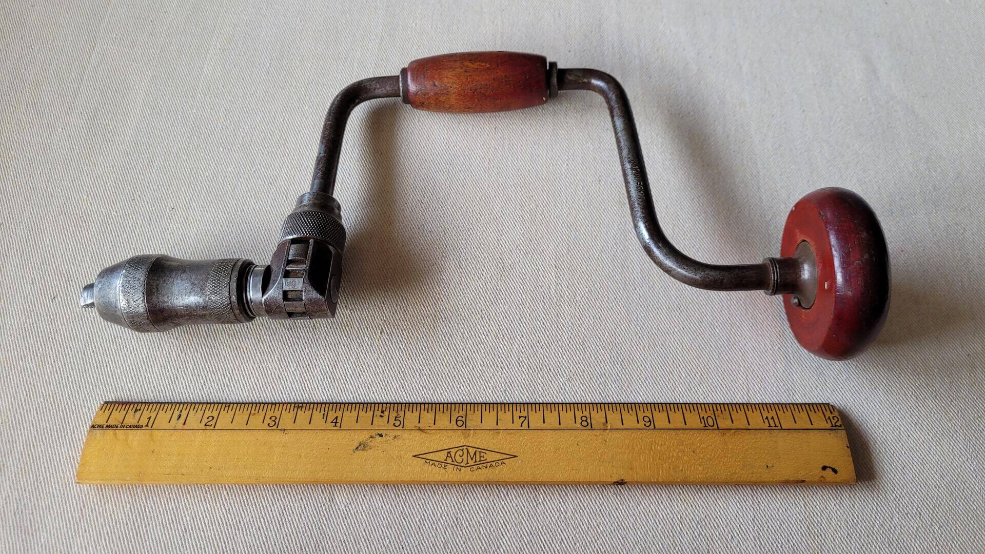 Antique ratcheting reversible auger bit brace hand drill. Vintage made in Canada collectible carpentry, woodworking and cabinet maker hand tools