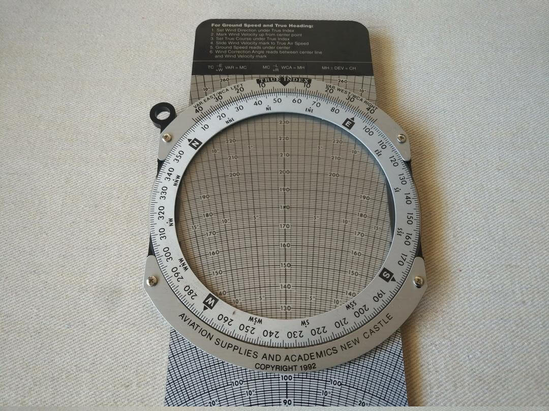 ASA Color E6-B solid aluminum manual flight computer slide-rule-style flight computer used for calculations and conversions for high-speed flight.