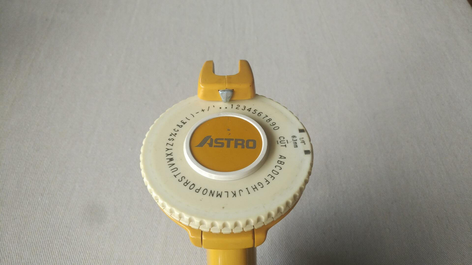 astro-yellow-rotary-label-maker-embosser-1970s-retro-vintage-made-in-usa-collectible-office-equipment-stationary-gadgets-letter-wheel