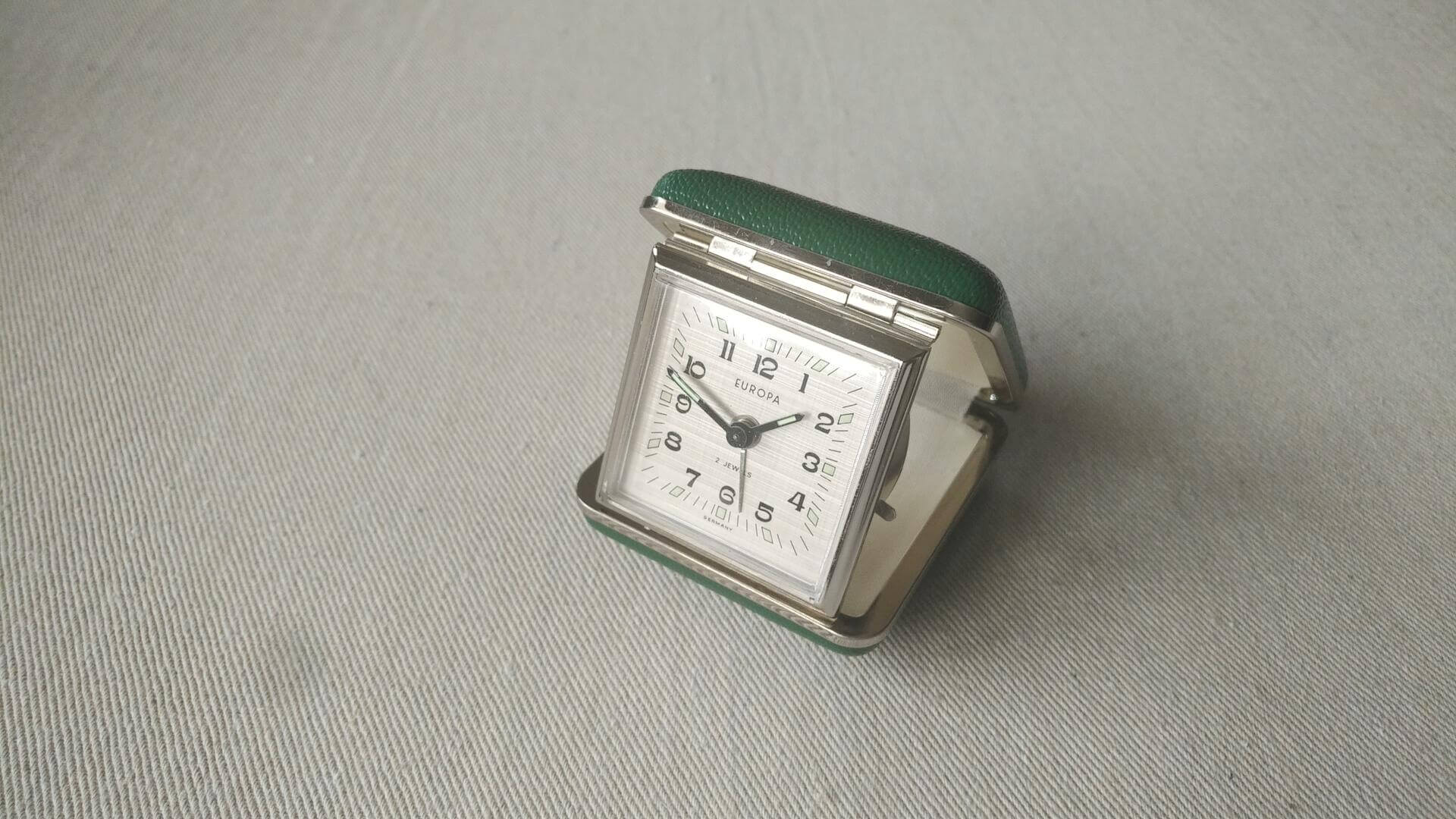Vintage solid steel mechanical Europa 2 jewel travel desk alarm clock in the green folding box. Antique made in Germany collectible desk watches & clocks