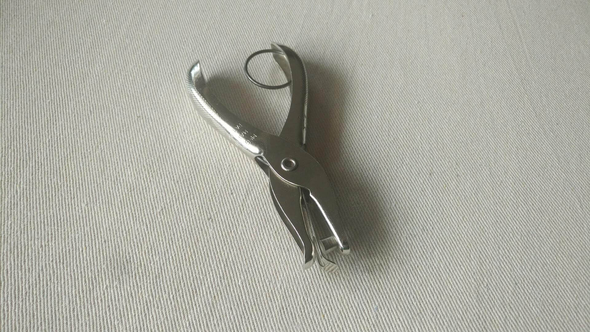 Vintage Gem handheld ticket & single hole paper punch by McGill Metal Products Co Marengo, IL. Antique made in USA office tools and stationery collectible.