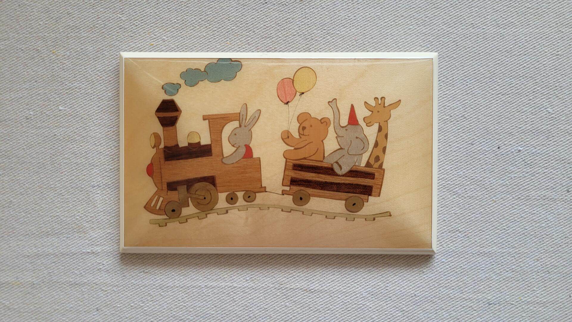 Beautiful Miss Bellevue Meta Di Sorrento wood inlay plaque picture for kids room showcasing animals riding a train. Vintage hand made made in Italy wood art