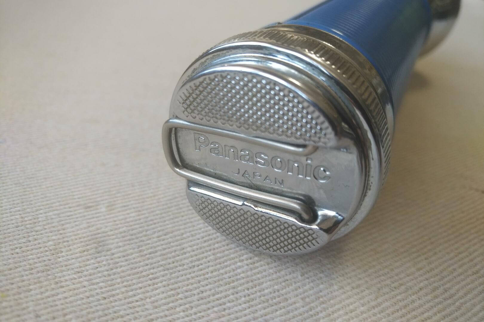 Vintage Panasonic emergency flashlight in chrome and blue. 1970s retro made in Japan collectible lightning and household tools
