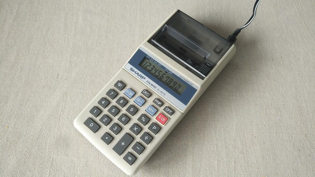 Vintage Sharp Elsi Mate model EL-1188S handheld printing calculator w the original adapter. Retro made in Japan collectible office equipment & electronics