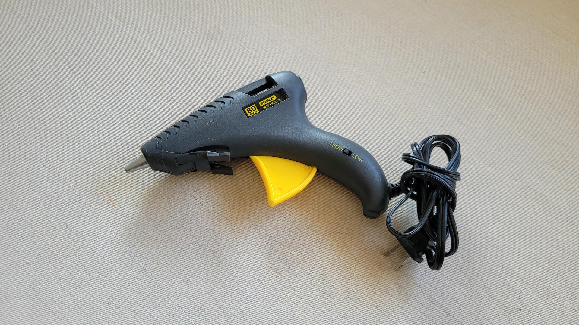 Stanley Dualmelt 80W trigger feed glue gun with the versatility of high and low temperature gluing in one hot melt gun w fold-out stand for handy storage