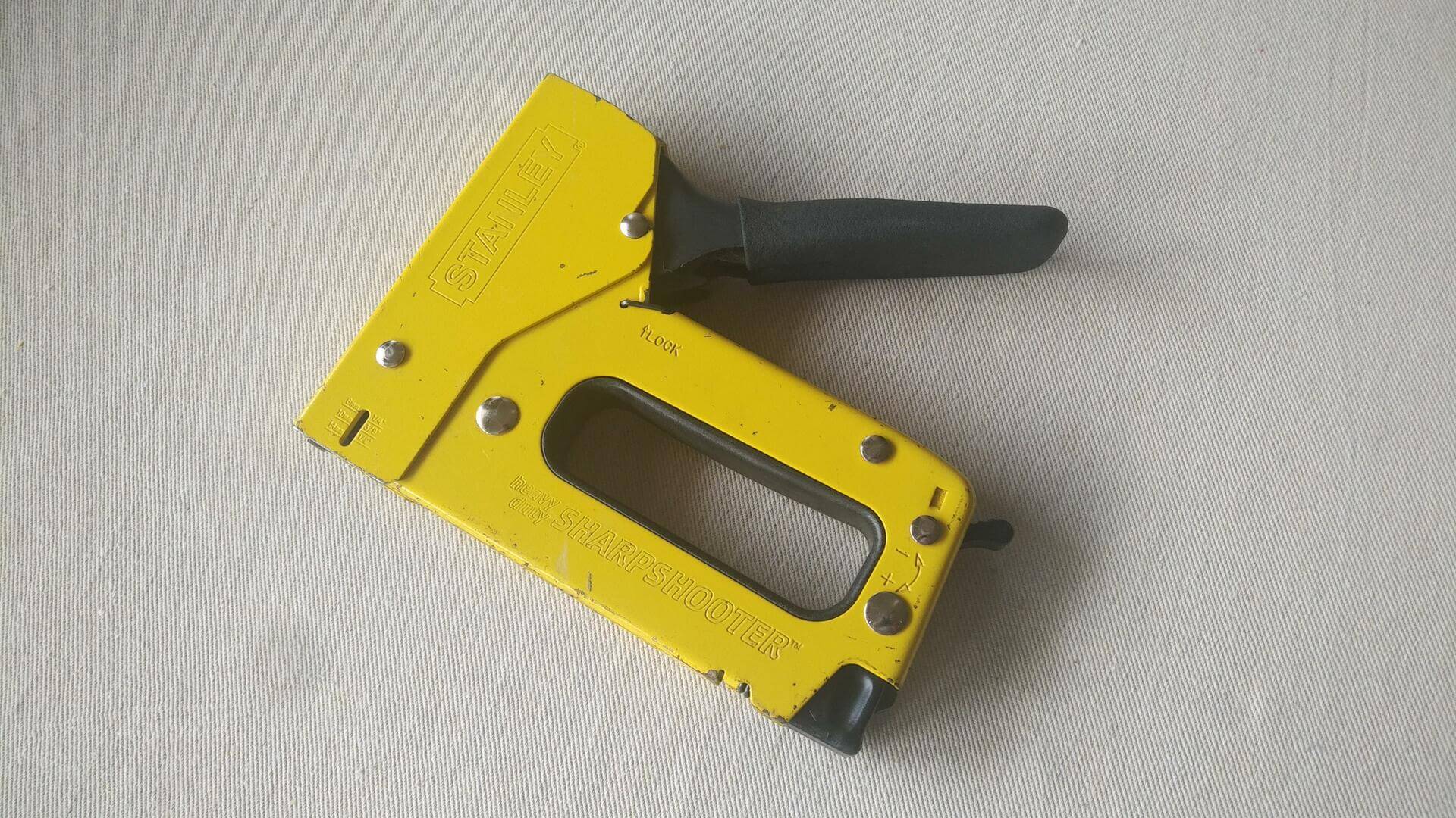 Rare vintage Stanley heavy duty Sharpshooter manual staple gun TR100 in yellow colour. Quality made in USA construction and upholstery nail and staple gun