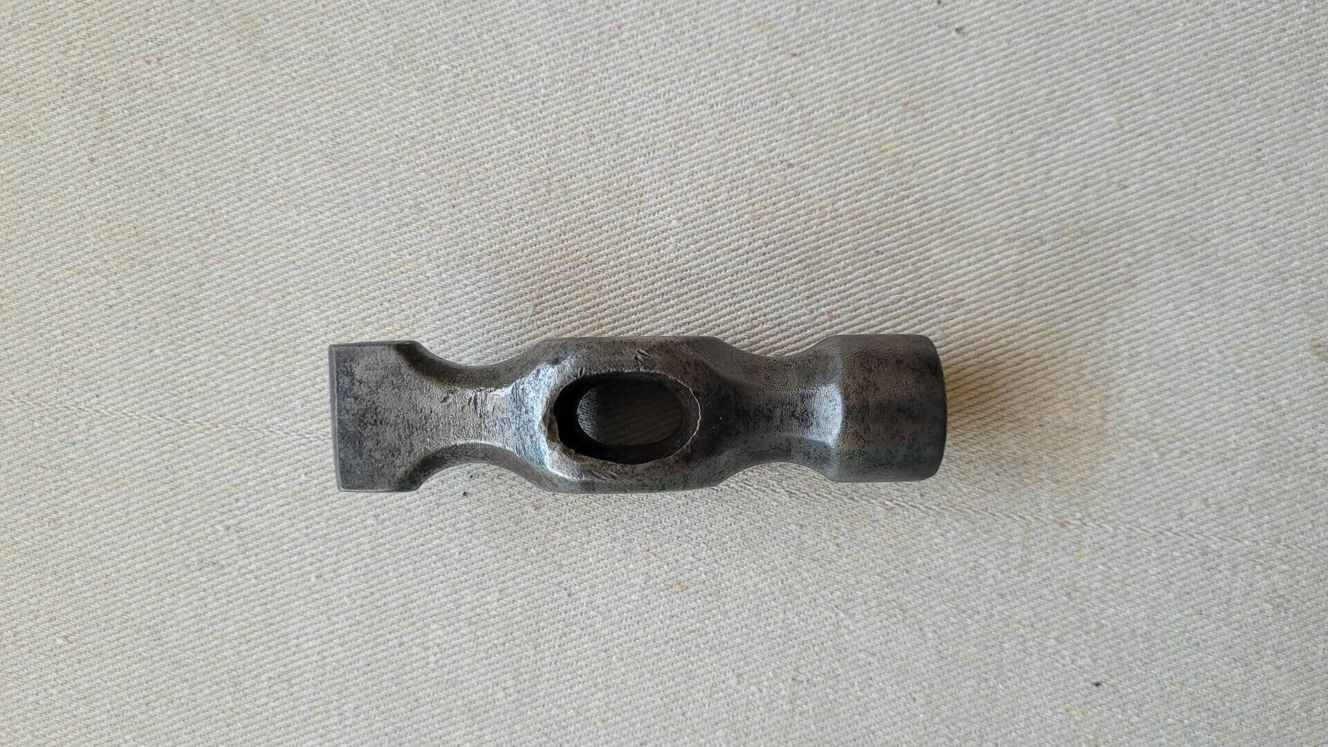 Vintage woodworking Warrington pattern cross pein joiners hammer head. Antique and collectible carpenter striking tool designed with a cast cross-peen end