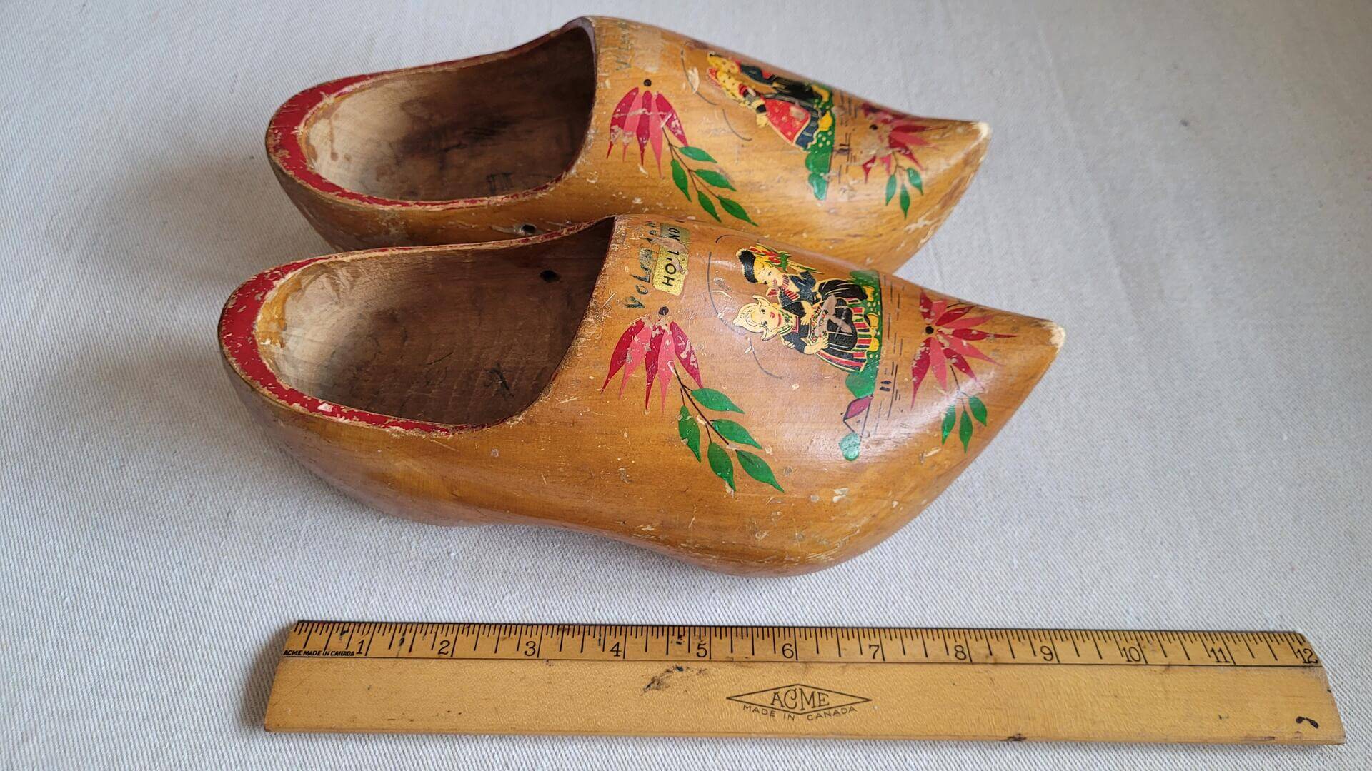 Nice vintage pair of hand painted wooden Dutch clogs with girls motif. Antique made in Holland collectible decorative hand made wood objects and art