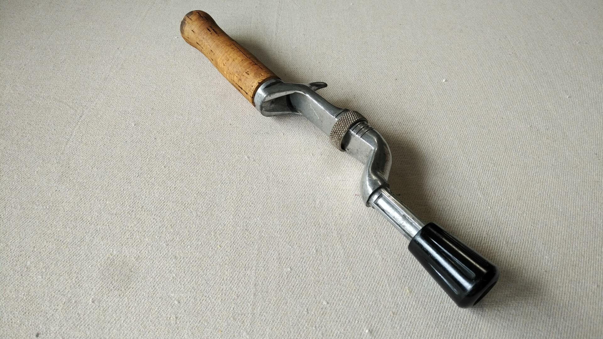 Vintage Dependun brand cast aluminum fishing rod handle with the cork handle. Mid century MCM collectible fishing and outdoors equipment and sporting goods
