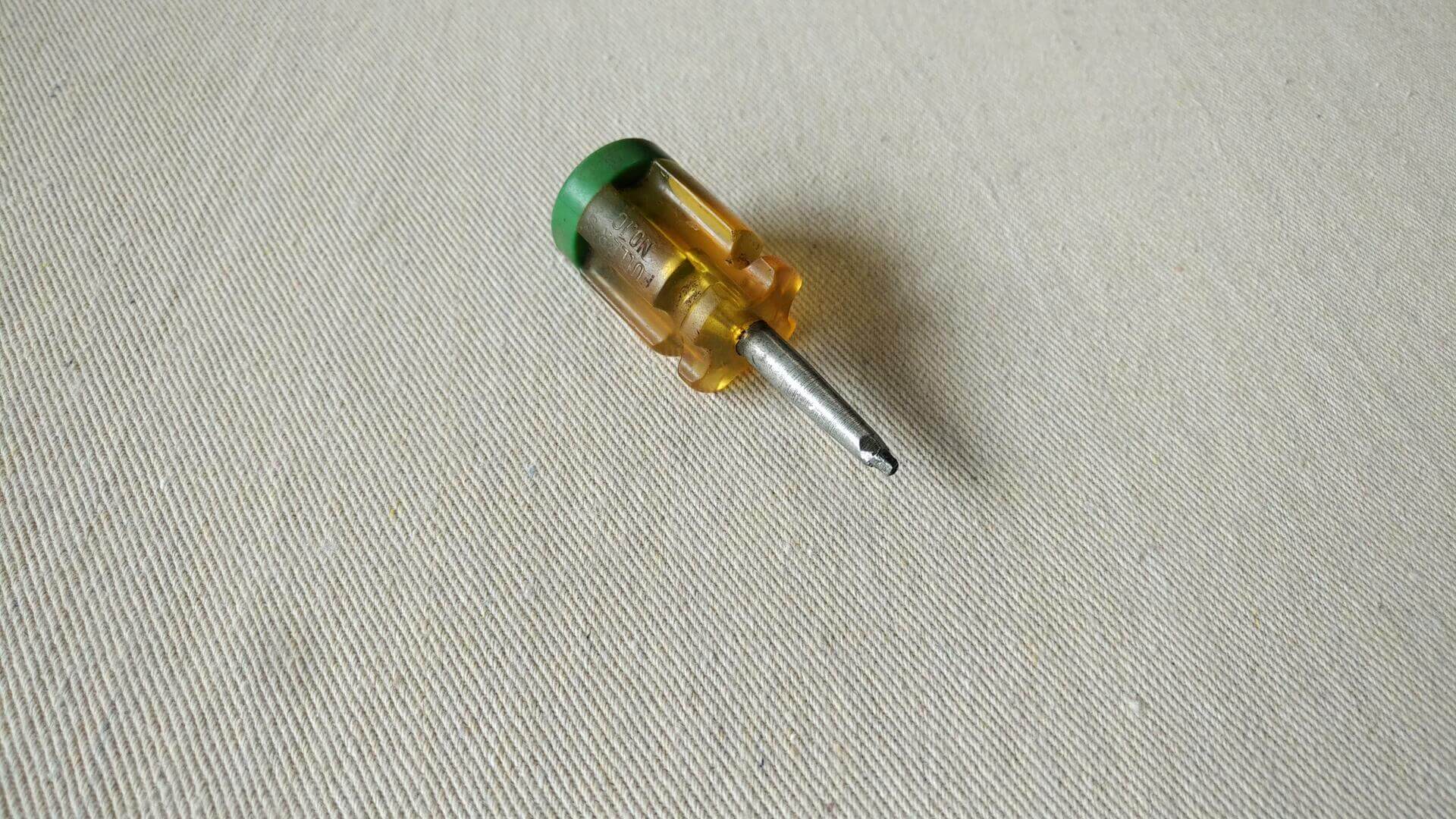 Fuller No. 10 Robertson head stubby screwdriver with yellow unbreakable handle and rubber top cap. Vintage collectible carpenter and electrician hand tools