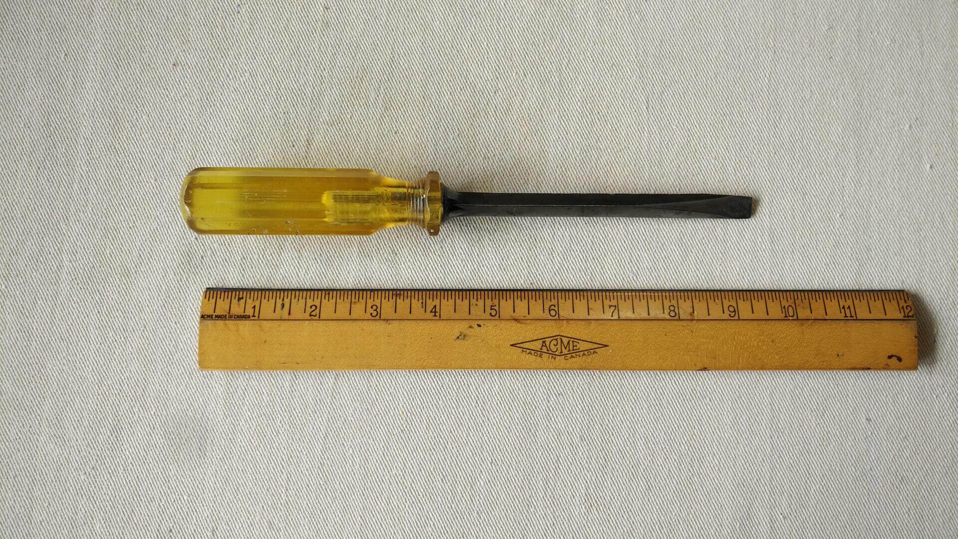 Gray No 606 heavy duty slotted screwdriver with square shaft and unbreakable yellow handle 9 1/2" long. Vintage made in Canada collectible hand tools